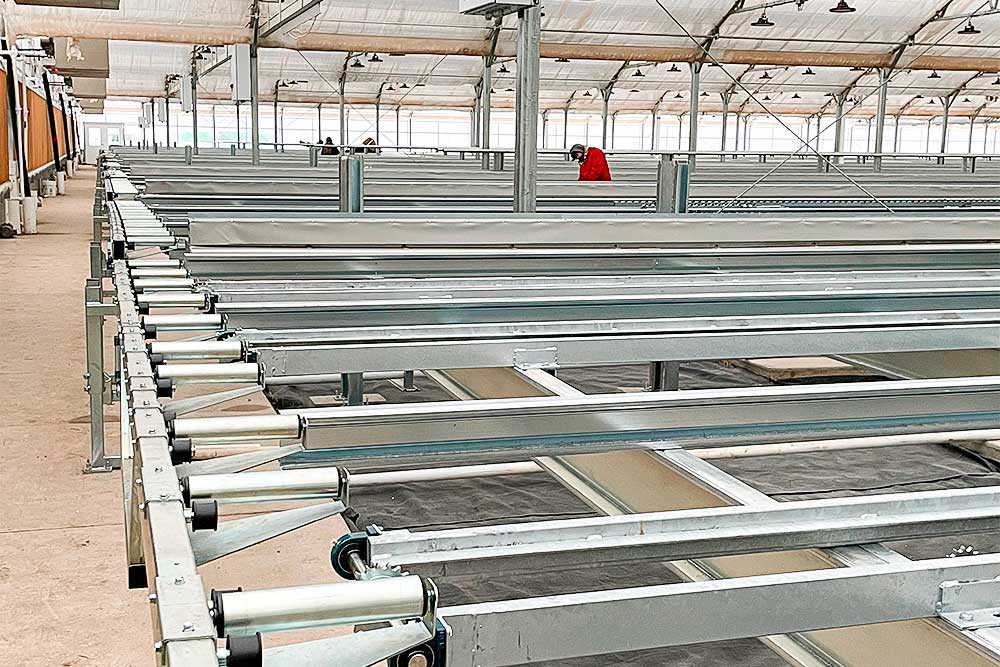 Conveyor rollers for gutter systems